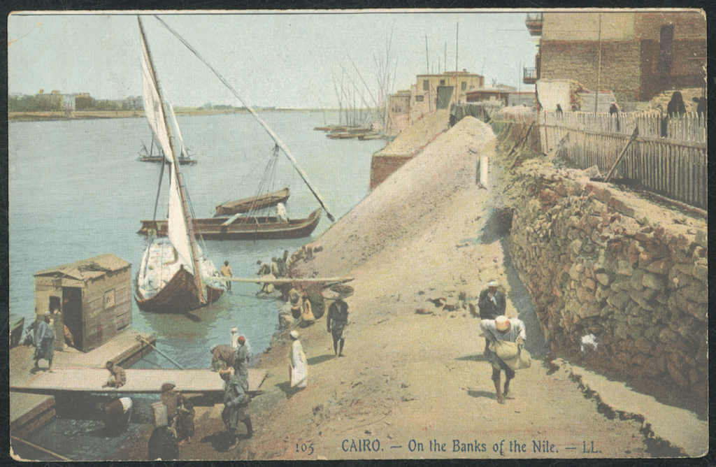 Colour printed photographic postcard depicting a river scene in Cairo, Egypt, in the early years of the 20th century.